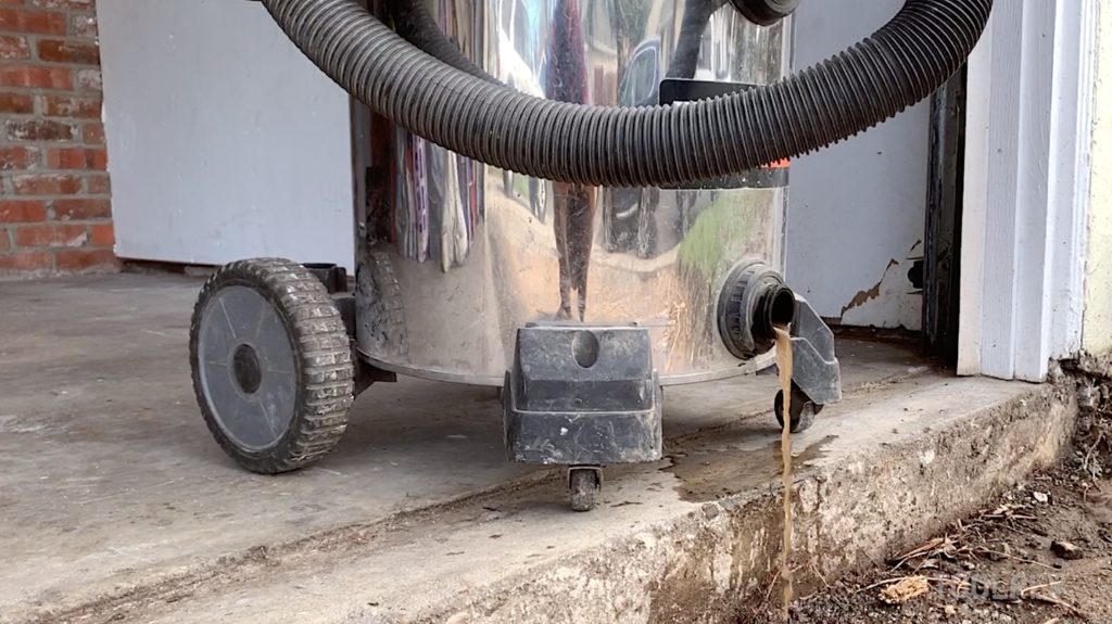 Ridgid stainless steel shop vac valve draining water.