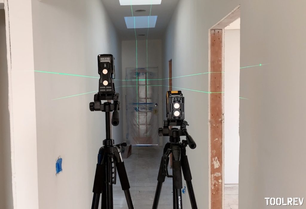 Makita and DeWalt laser lines on hallway walls.