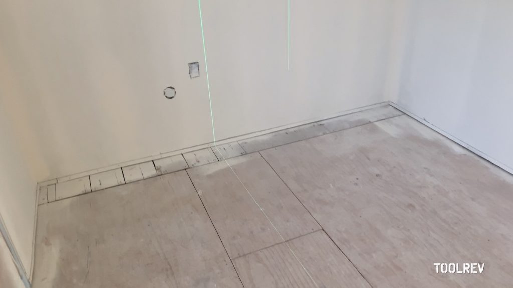 Laser level lines on kitchen floor.