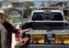Dewalt corded and cordless table saws, yellow and black, on truck bed.