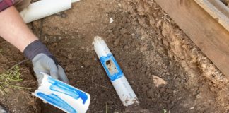 Broken drain pipe being fixed