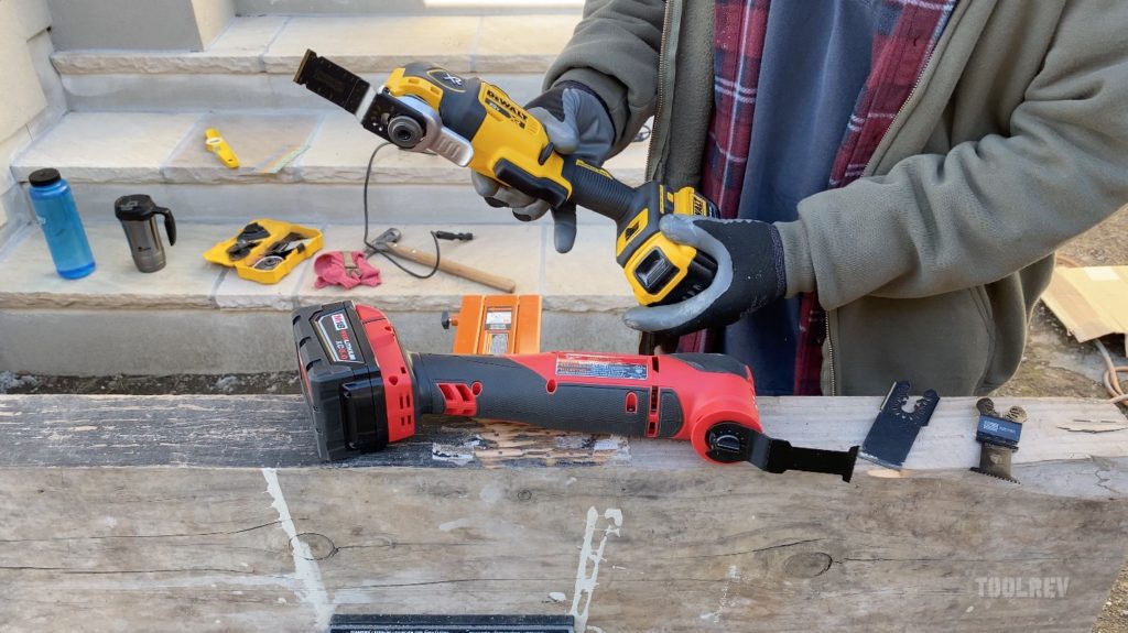 worker holding dewalt multi tool