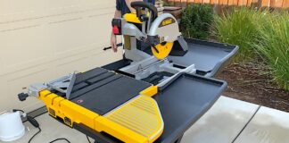 dewalt tile saw in yellow and black in driveway