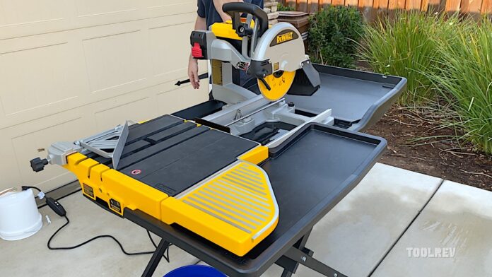 dewalt tile saw in yellow and black in driveway