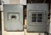 two residential electrical panel boxes on a garage wall.