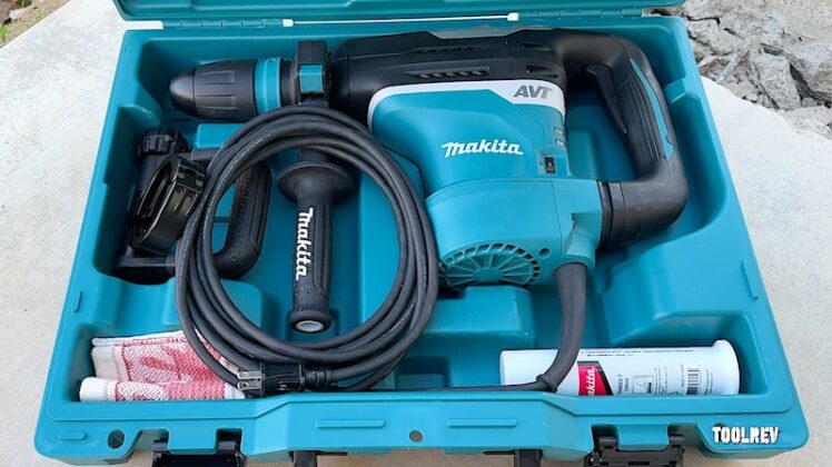 Makita rotary hammer in case with accessories.