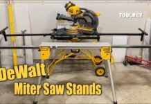 Dewalt portable rolling and folding miter saw stands in garage.