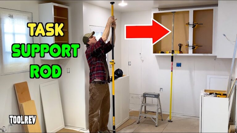 Task support rod holding up a kitchen cabinet during construction.