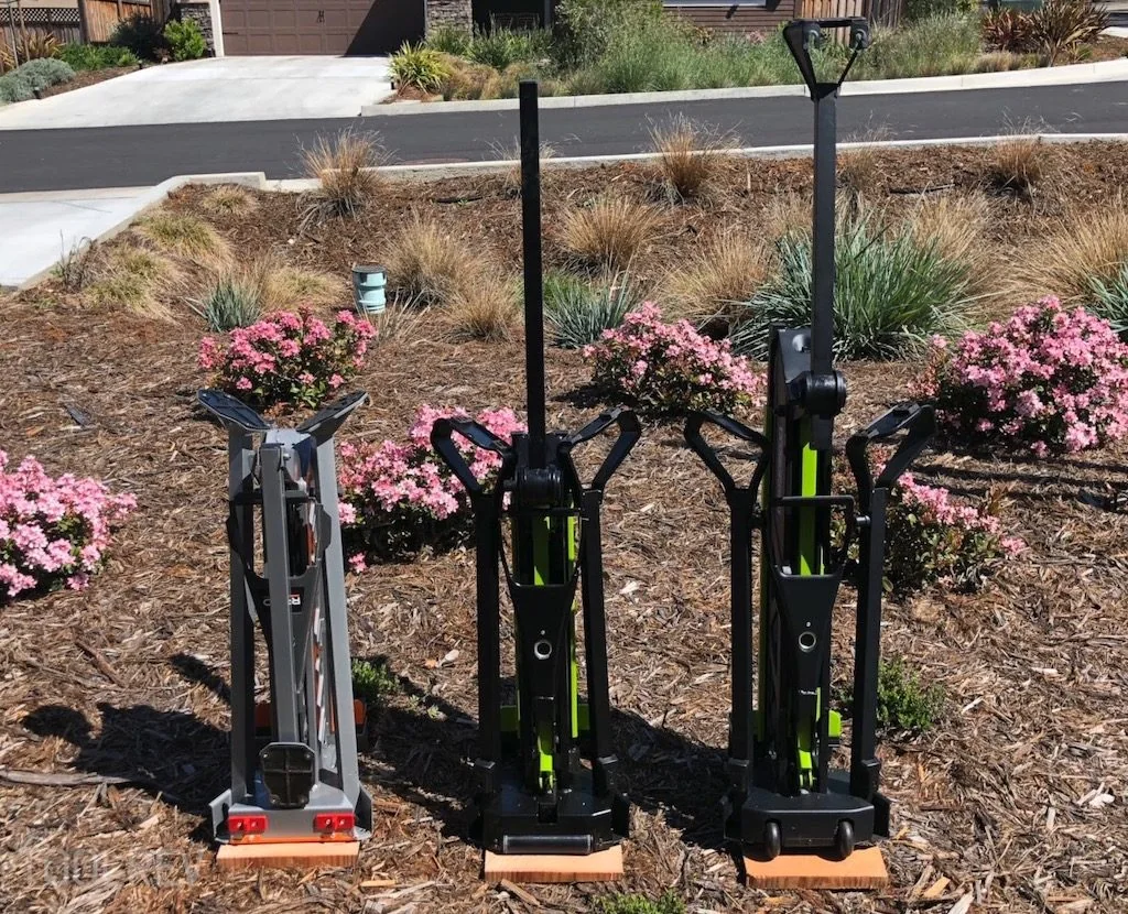 RIDGID, Jawhorse, and Rockwell clamp stands folded upright RIDGID, Jawhorse, and Rockwell clamp stands folded upright