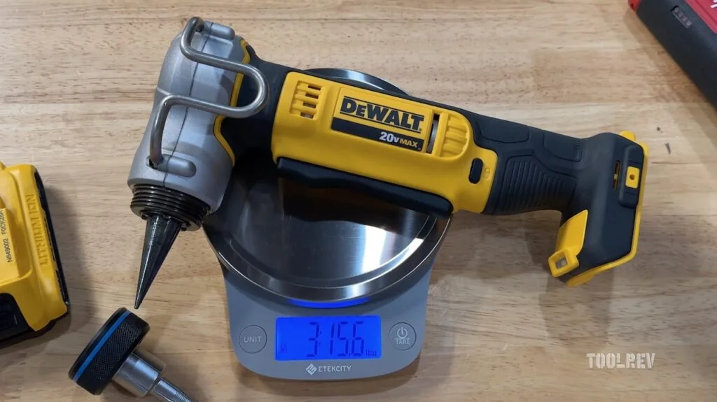 DeWalt PEX Expander tool with a yellow and black design being weighed. DeWalt PEX Expander tool with a yellow and black design being weighed.