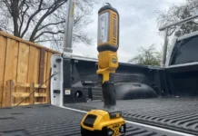DeWalt 20V LED Work Light (DCL050): Bright, Versatile, and Built to Last DeWalt DCL050 LED work light in yellow and black, on truck tailgate