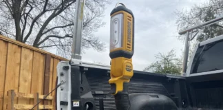 DeWalt 20V LED Work Light (DCL050): Bright, Versatile, and Built to Last DeWalt DCL050 LED work light in yellow and black, on truck tailgate