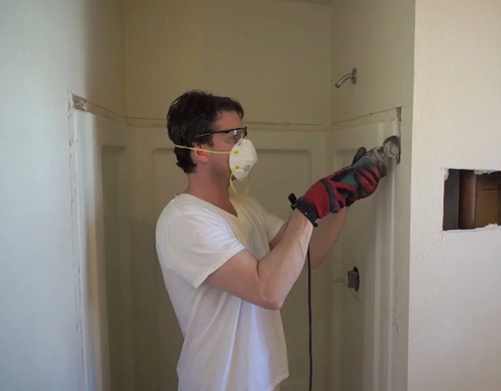 Exposing shower flange by removing drywall