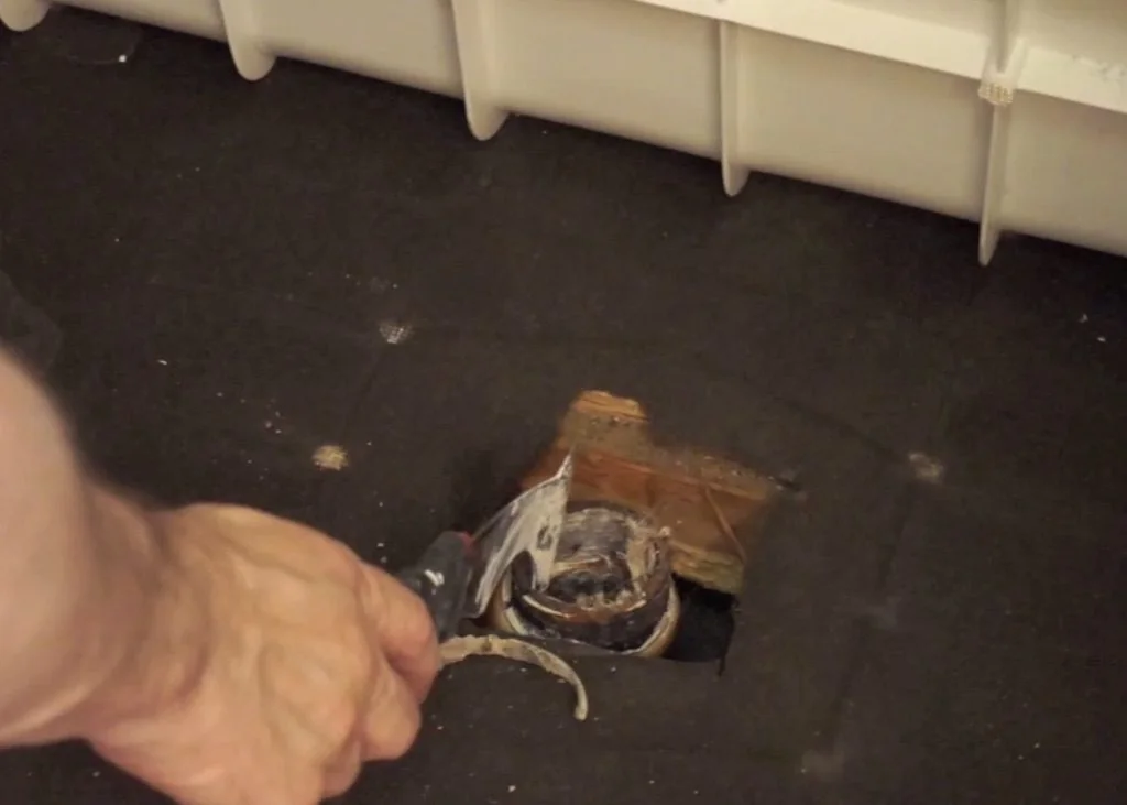 Open shower drain pipe before capping