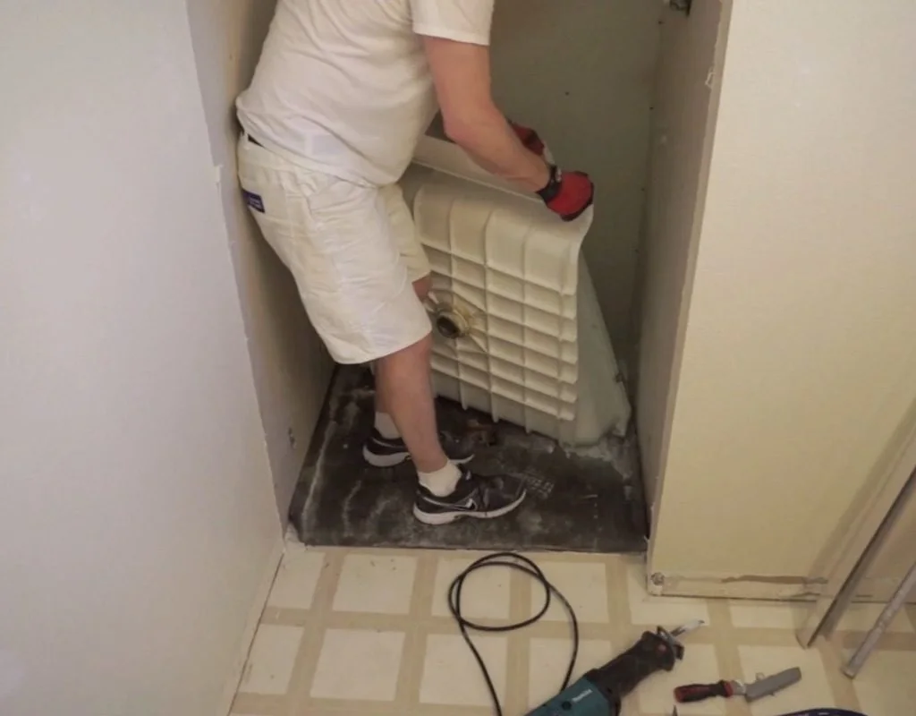 Lifting out the shower pan base