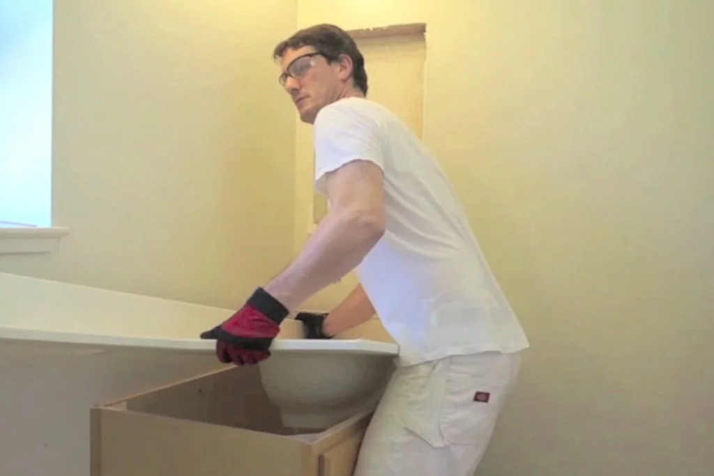 Lifting the sink and countertop off a bathroom vanity Lifting the sink and countertop off a bathroom vanity