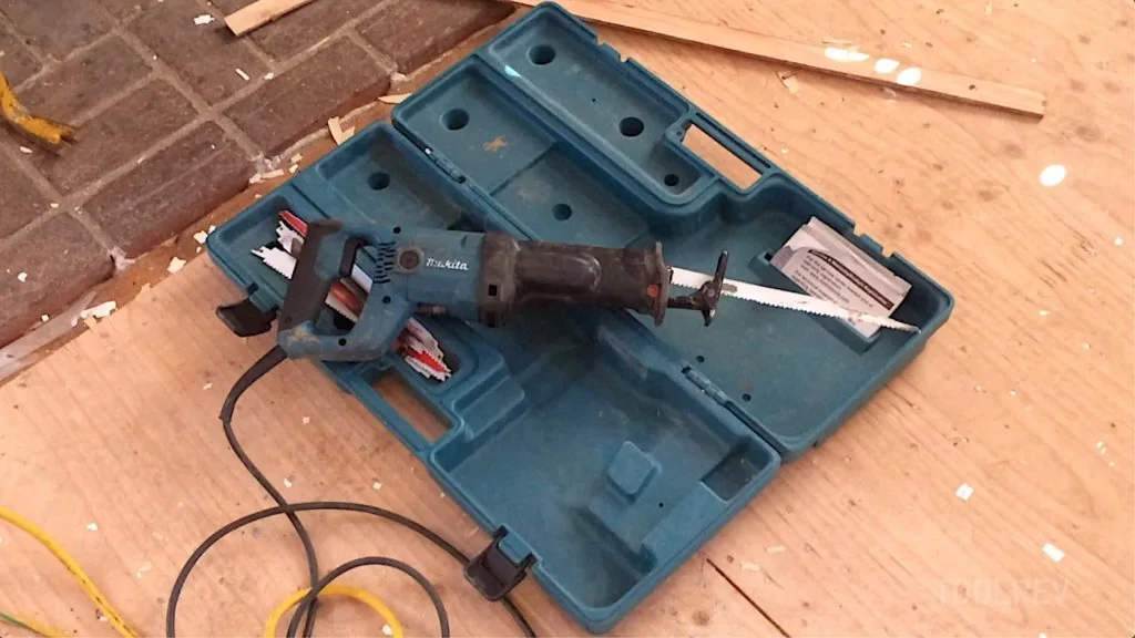 Makita corded reciprocating saw and blades in a case Makita corded reciprocating saw and blades in an open case on a wood floor