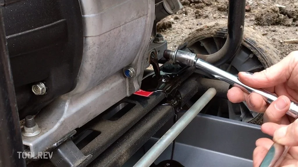 Draining oil from a Honda generator into a pan