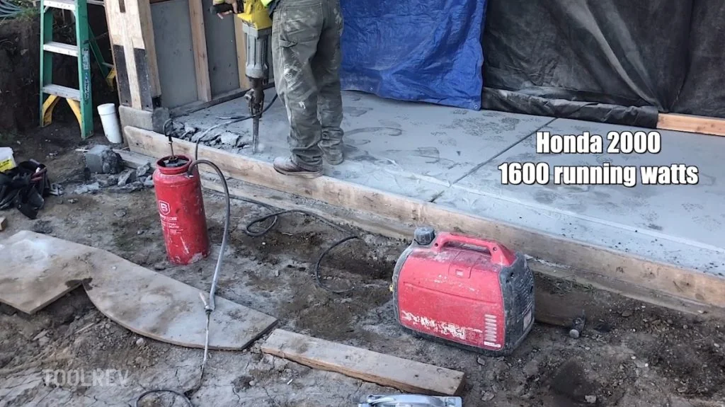 Honda 2000-watt generator running a rotary hammer, labeled 1600 running watts