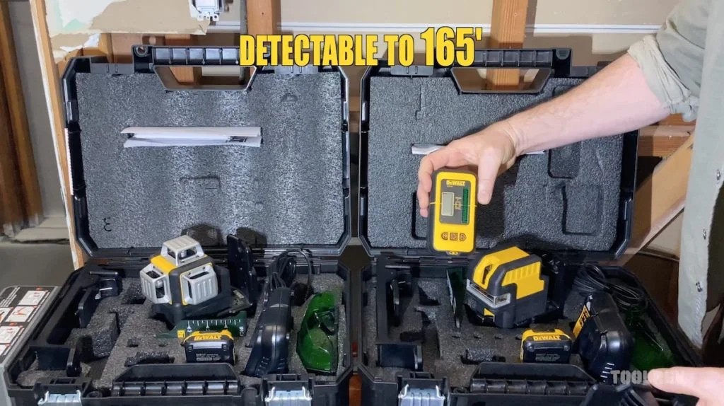 DeWalt green and red 360-degree laser levels in open carrying cases DeWalt green and red 360-degree laser levels in open carrying cases