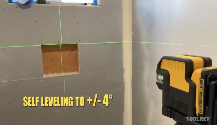 DeWalt green laser level shining on bathroom wall.