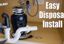 How to Install a Garbage Disposal Garbage disposal mounted under a kitchen sink with drain pipes, easy disposal install