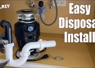 How to Install a Garbage Disposal Garbage disposal mounted under a kitchen sink with drain pipes, easy disposal install